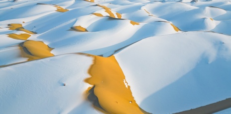 Snow falls on the Taklimakan Desert in Bazhou