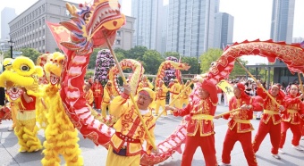 Lion and dragon performances illuminate May Day celebrations