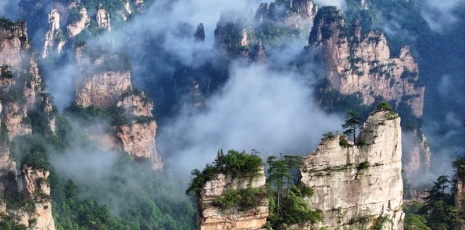 Sea of clouds drifts through Shili Gallery at Zhangjiajie after rain
