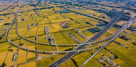 High-speed trails & golden wheat fields paint a harmonious landscape