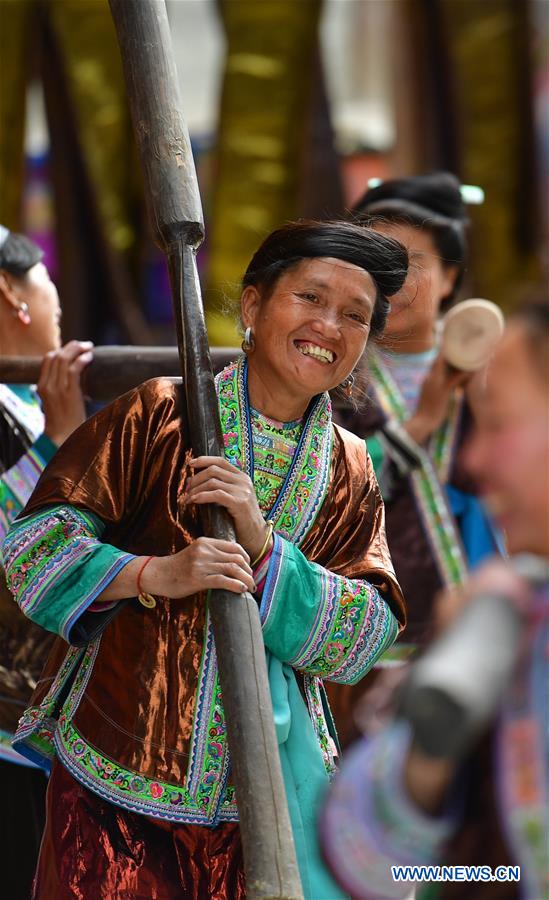 Women attend Liang Bu fair in Dangjiu Village, S China