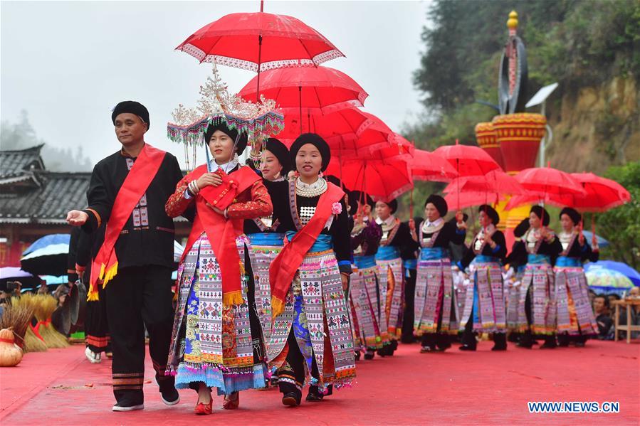 People of Yao ethnic group perform during harvest festival in Guangxi